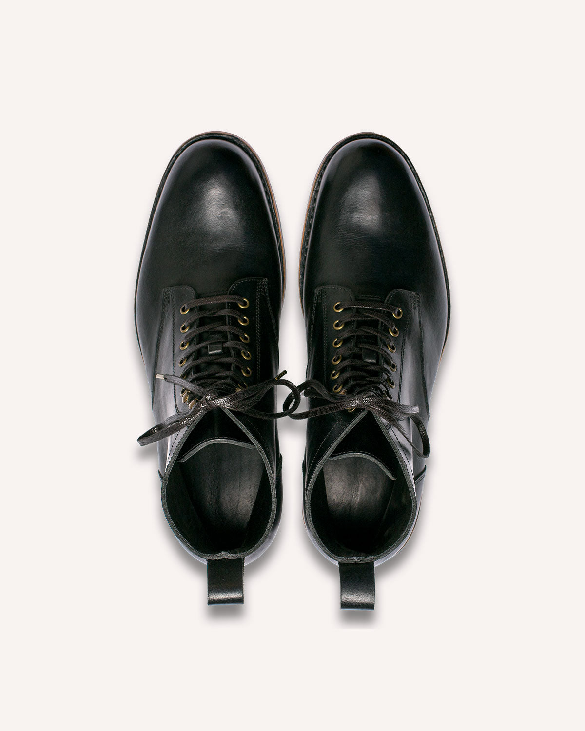 A pair of Derby Boots from Archive Leather Goods, in Black Horween Dublin leather; top-down view.