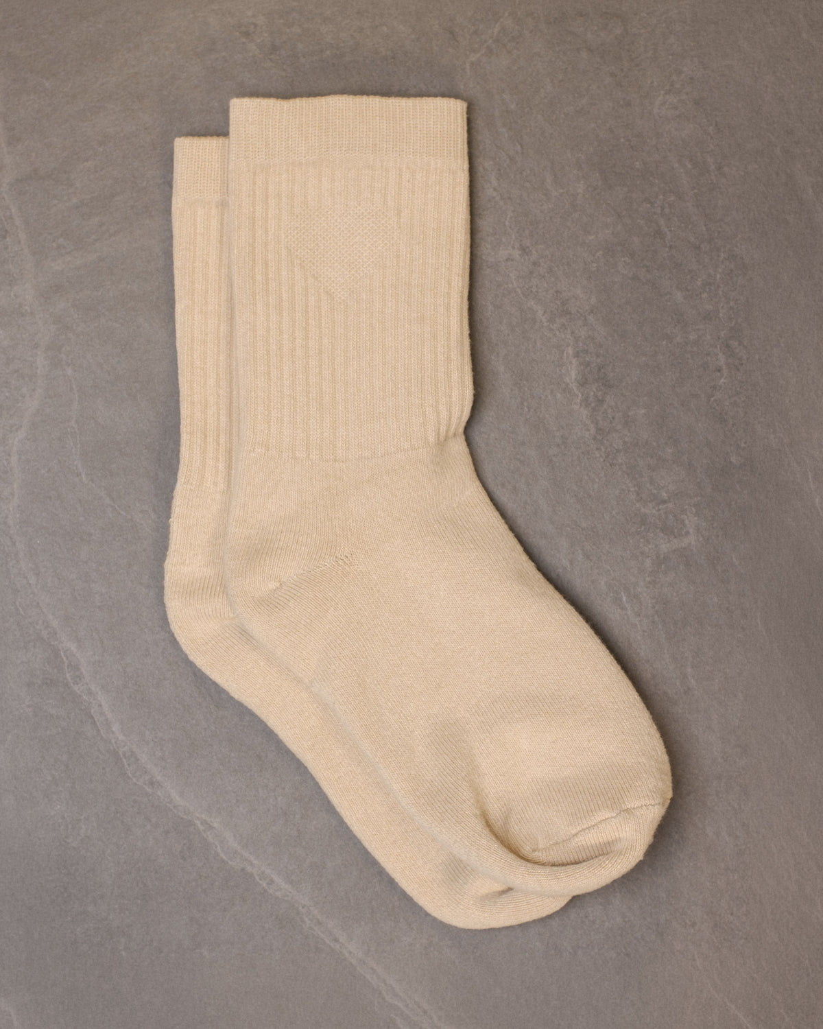 Close-up of a pair of Foundation Socks from Archive Leather Goods in Driftwood (natural).